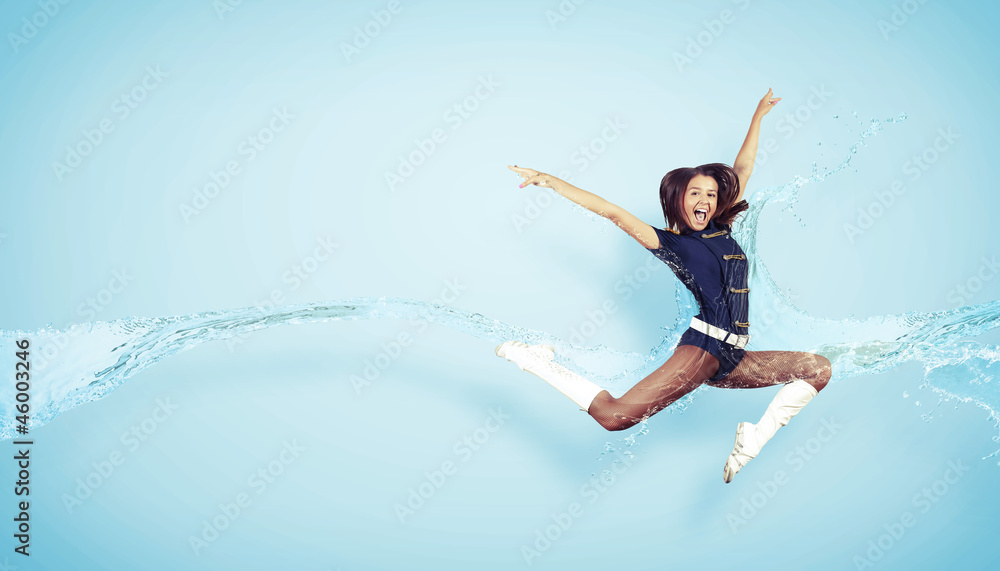 Young woman dancer. With lights effect.