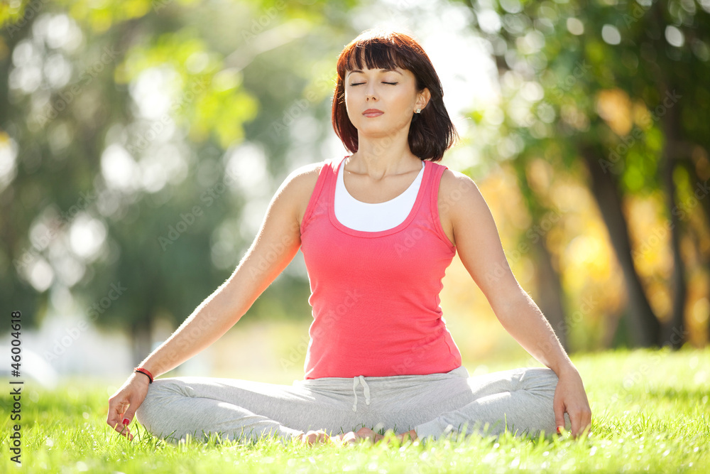 Pretty woman meditate in the park Pretty woman meditate in the park