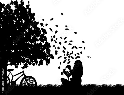 Girl with bike playing in the park with leaves silhouette