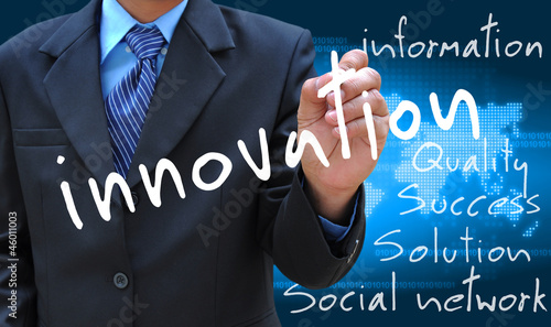 businessman hand writing innovation