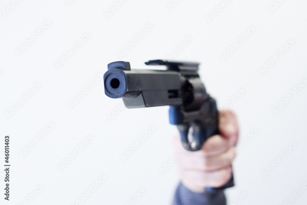 handgun pointed at camera