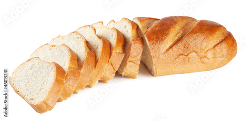 Fresh white loaf with slices isolated on white background