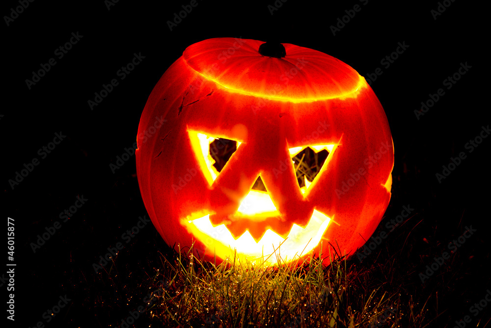 Halloween pumpkin on some grass Halloween pumpkin on some grass