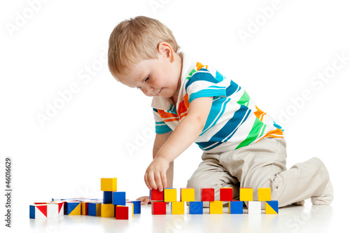 kid boy playing toy blocks ...