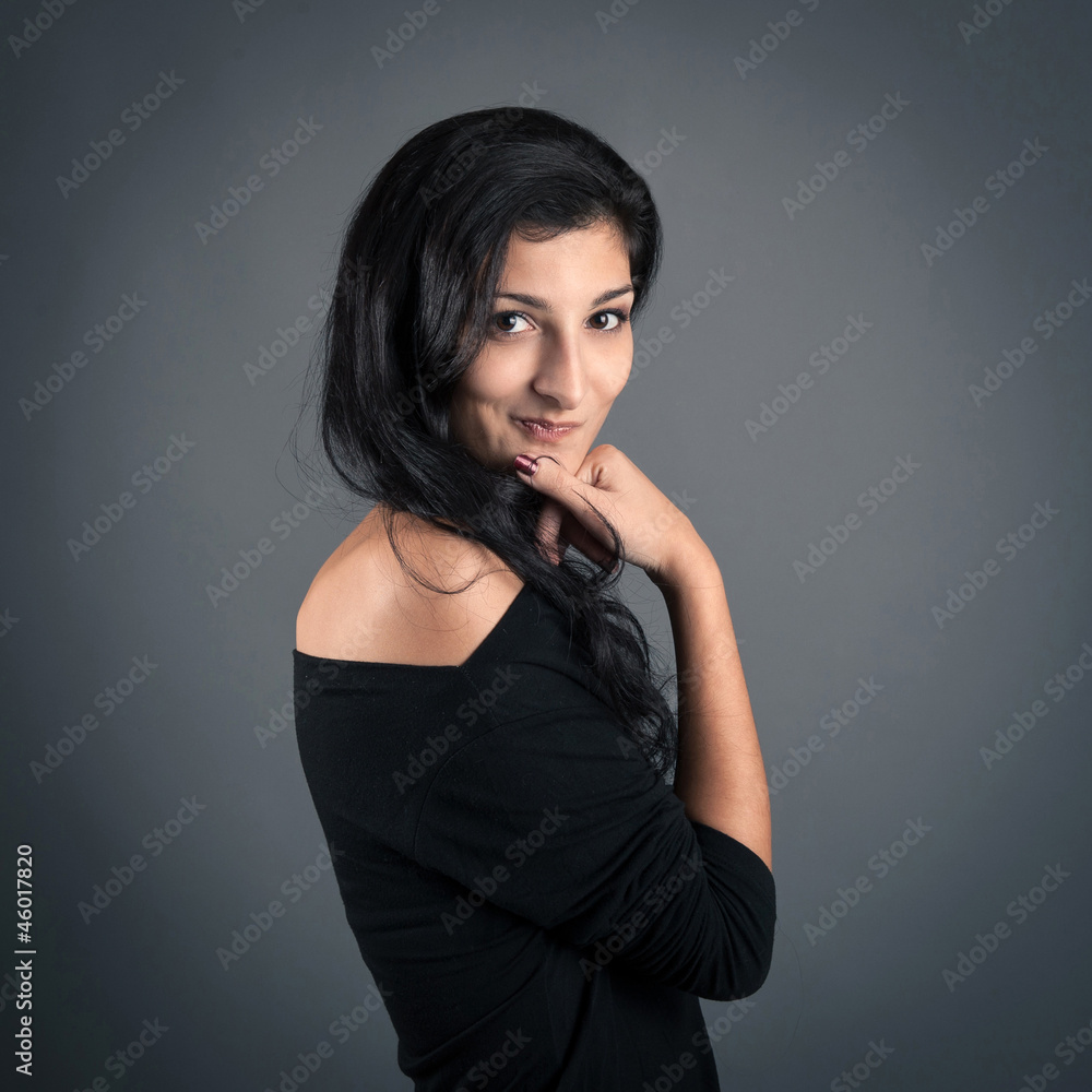 Naklejka premium Woman close up portrait on dark background.