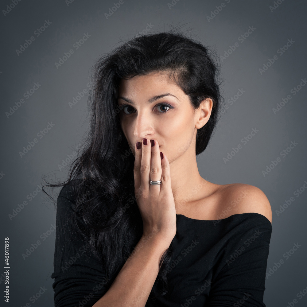 Woman close up portrait on dark background. Surprised expression Woman close up portrait on dark background. Surprised expression
