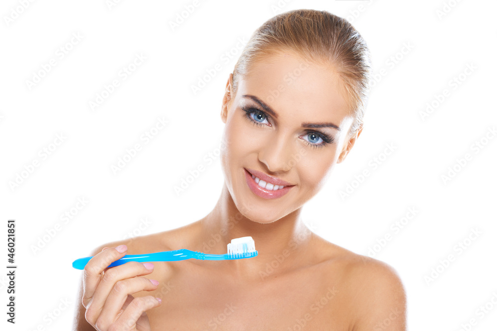 Closeup portrait of a woman brushing her teeth Closeup portrait of a woman brushing her teeth