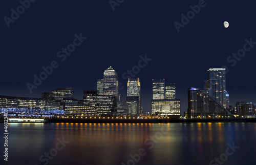 The cityscape of Canary Wharf in London at night.