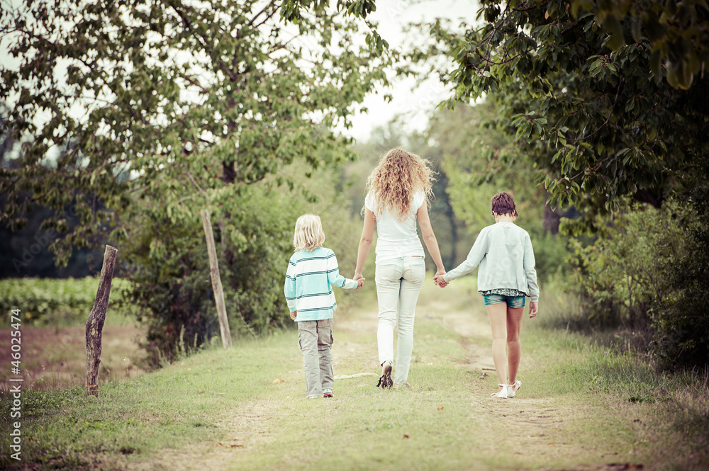 Beautiful Young Woman with Two Children Outside Beautiful Young Woman with Two Children Outside