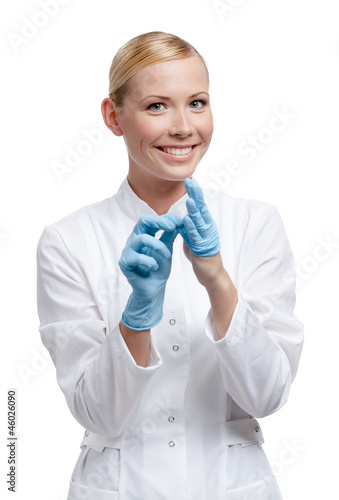 Practitioner puts off the medical blue gloves