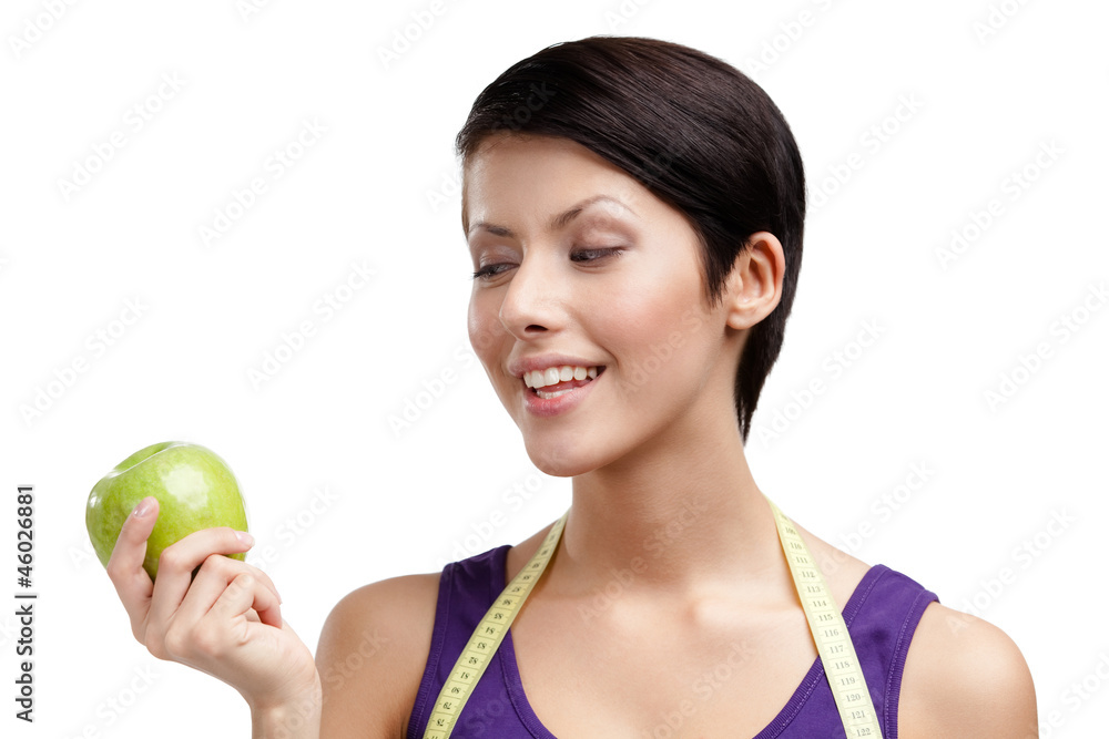 Lady with flexible ruler and green ripe apple, isolated on white Lady with flexible ruler and green ripe apple, isolated on white