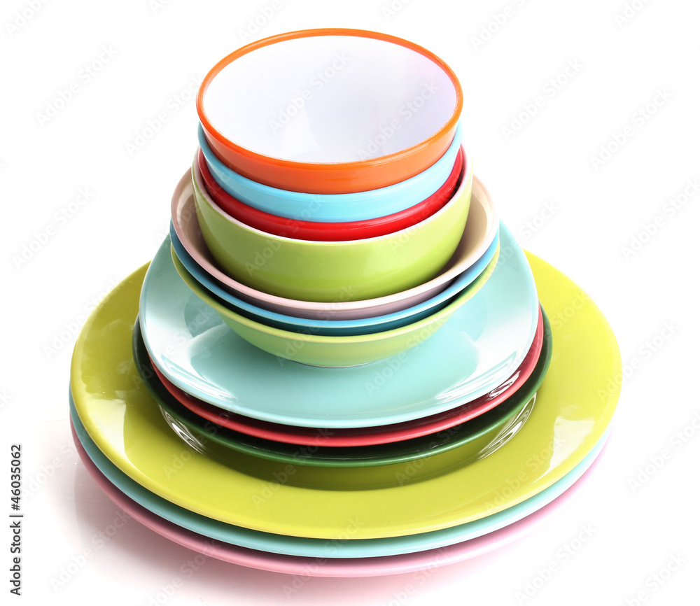 Many colorful plates isolated on white Many colorful plates isolated on white