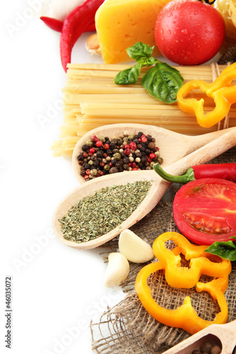 Pasta spaghetti, vegetables and spices, isolated on white