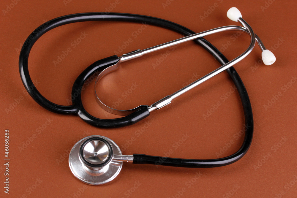 Stethoscope on brown background Stethoscope on brown background