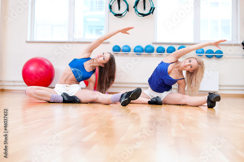 Women do stretching exercise