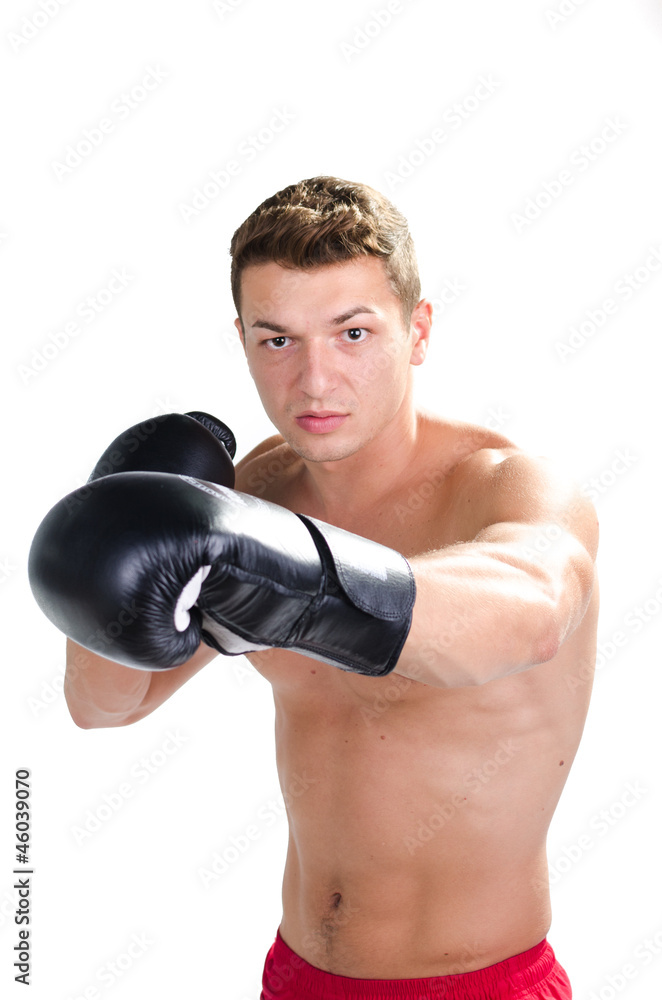 Muscular man boxing