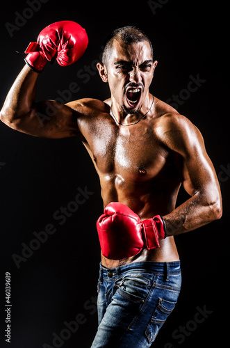 Young man with boxing gloves © Elnur