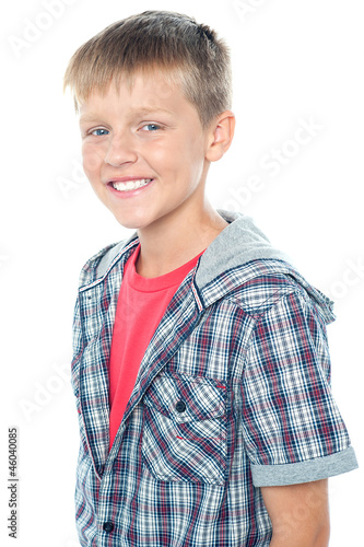 Cheerful young caucasian boy posing