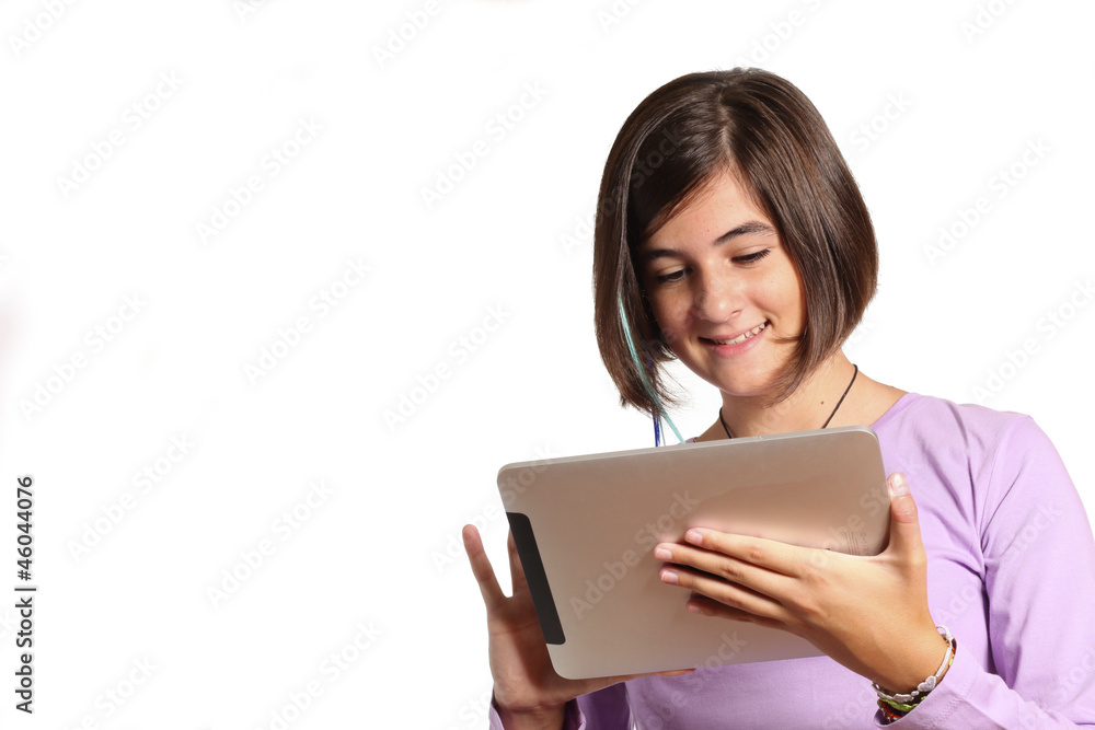 Isolated portrait of a teenage girl with tablet . Isolated portrait of a teenage girl with tablet .