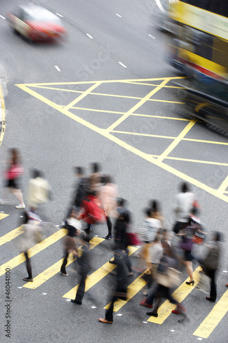 Overhead View Of Commuters Crossing Busy Hong Kong Street photo