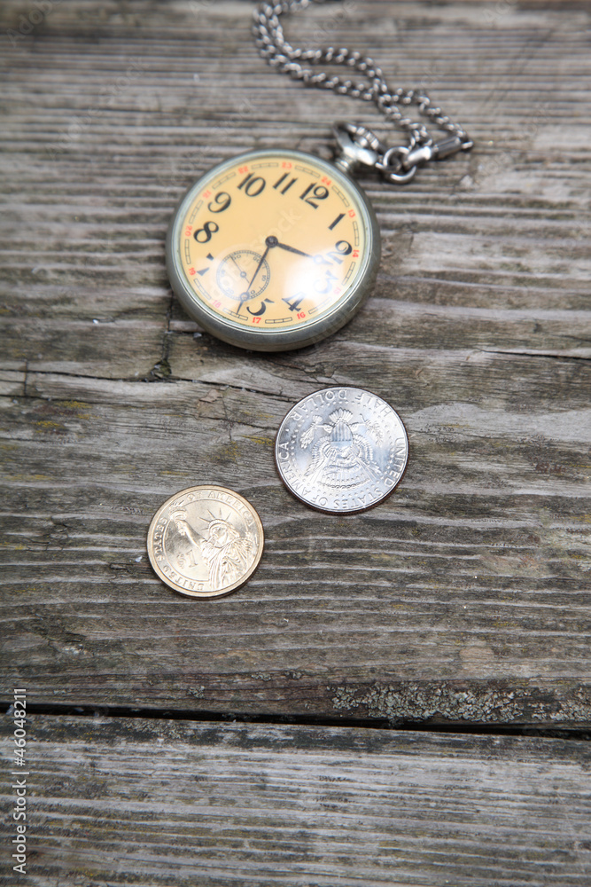 Old clock and coins Old clock and coins