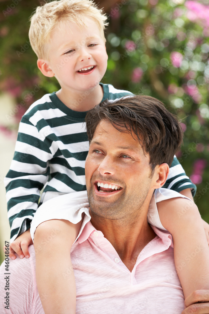 Father Giving Son Ride On Shoulders Outdoors Father Giving Son Ride On Shoulders Outdoors