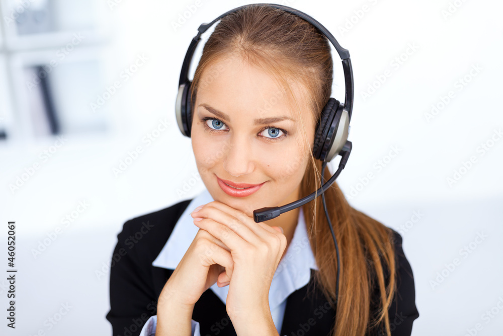 Portrait of pretty young female operator