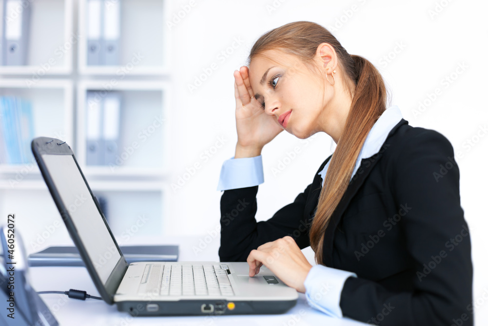 Portrait of beautiful young smiling business woman working Portrait of beautiful young smiling business woman working