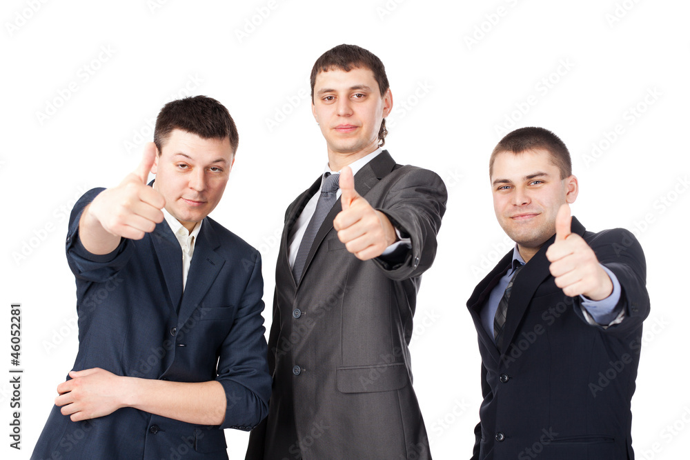 Three young business men laughing and giving the thumbs up sign Three young business men laughing and giving the thumbs up sign