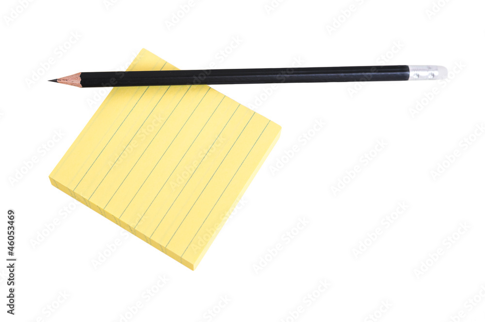 Fototapeta premium Sharp black pencil on a pack of post-it notes