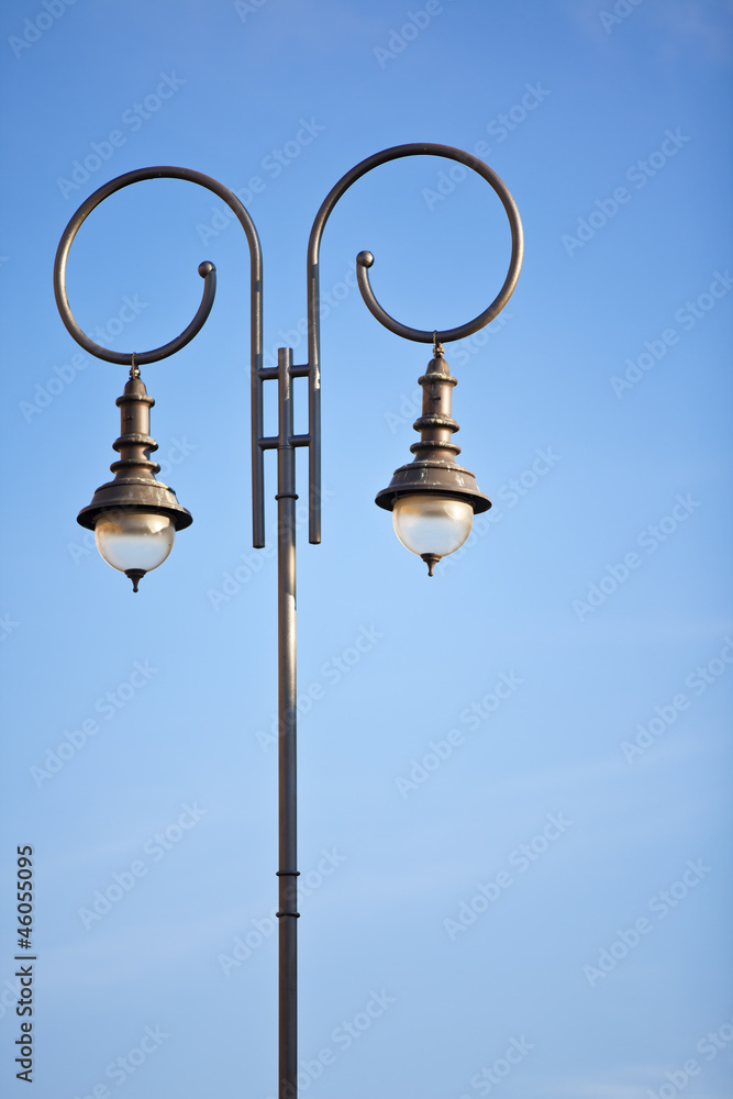 Lamp post against clear blue sky Lamp post against clear blue sky