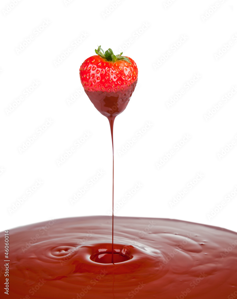 Strawberry dipped in melting dark chocolate Strawberry dipped in melting dark chocolate