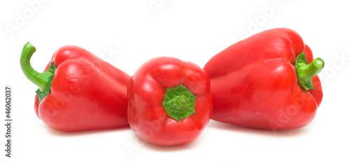 three peppers on a white background close-up