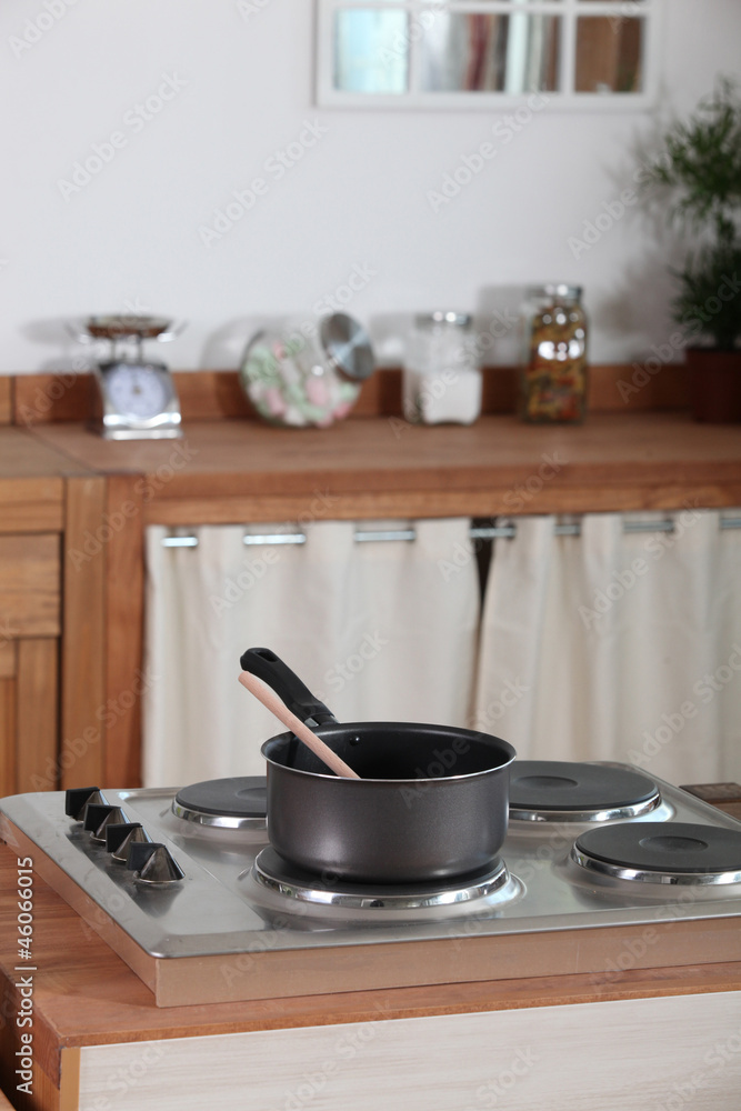 Pan sitting on an electric hob Pan sitting on an electric hob