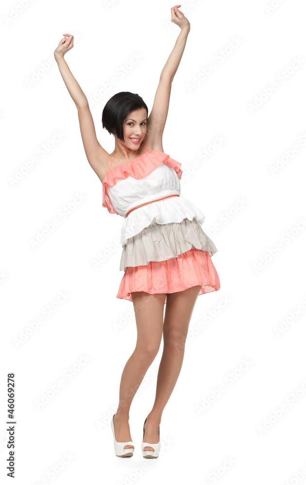 Dancing girl in colored dress, isolated on white Dancing girl in colored dress, isolated on white