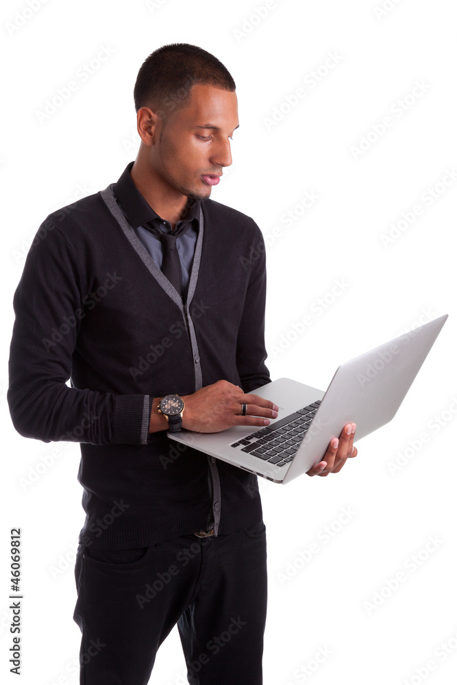 Young african american man using a laptop Young african american man using a laptop