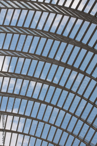 Arched glass roof with clouds