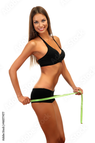 beautiful young woman with measuring tape, isolated on white