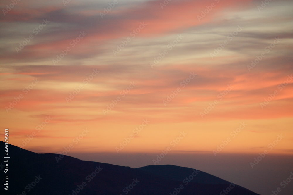 sunset over mountain ridge