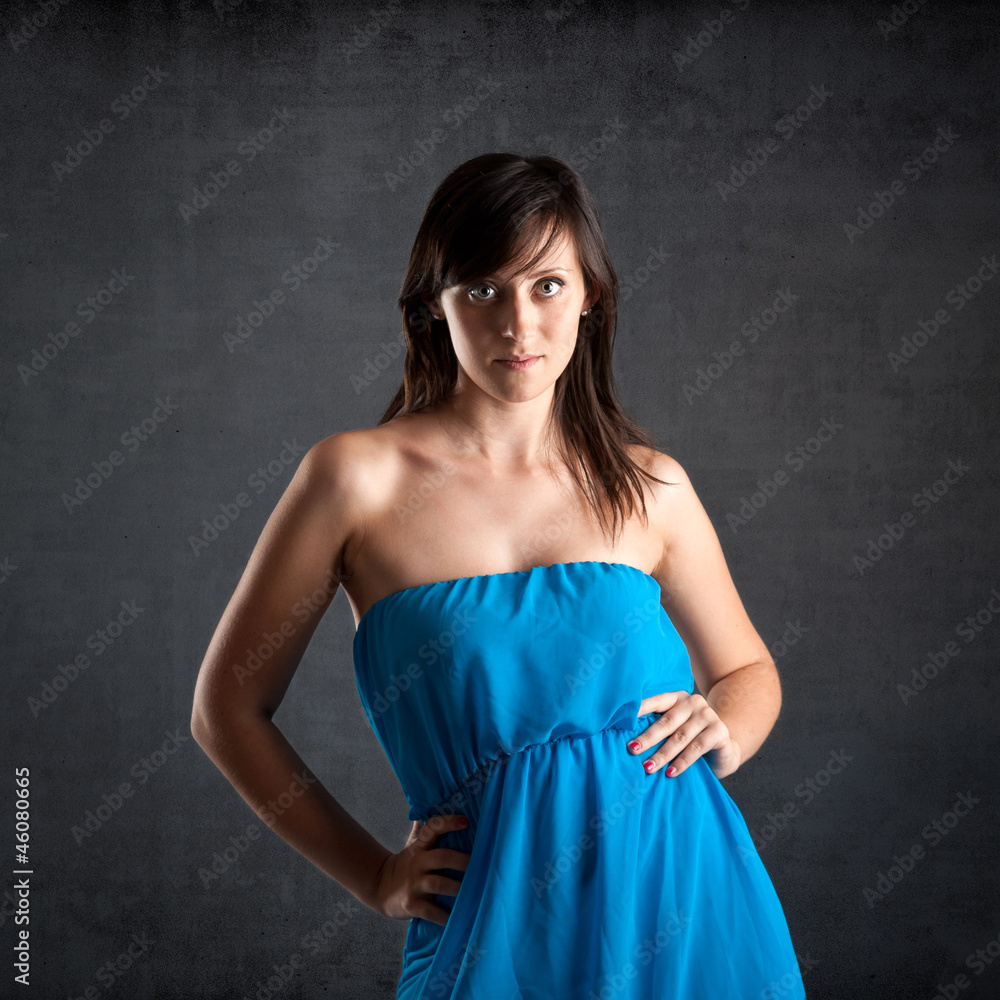 Obraz premium Beautiful woman close up portrait against dark grunge background