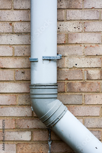 Obraz na płótnie Brick Wall with Drain Pipe w salonie