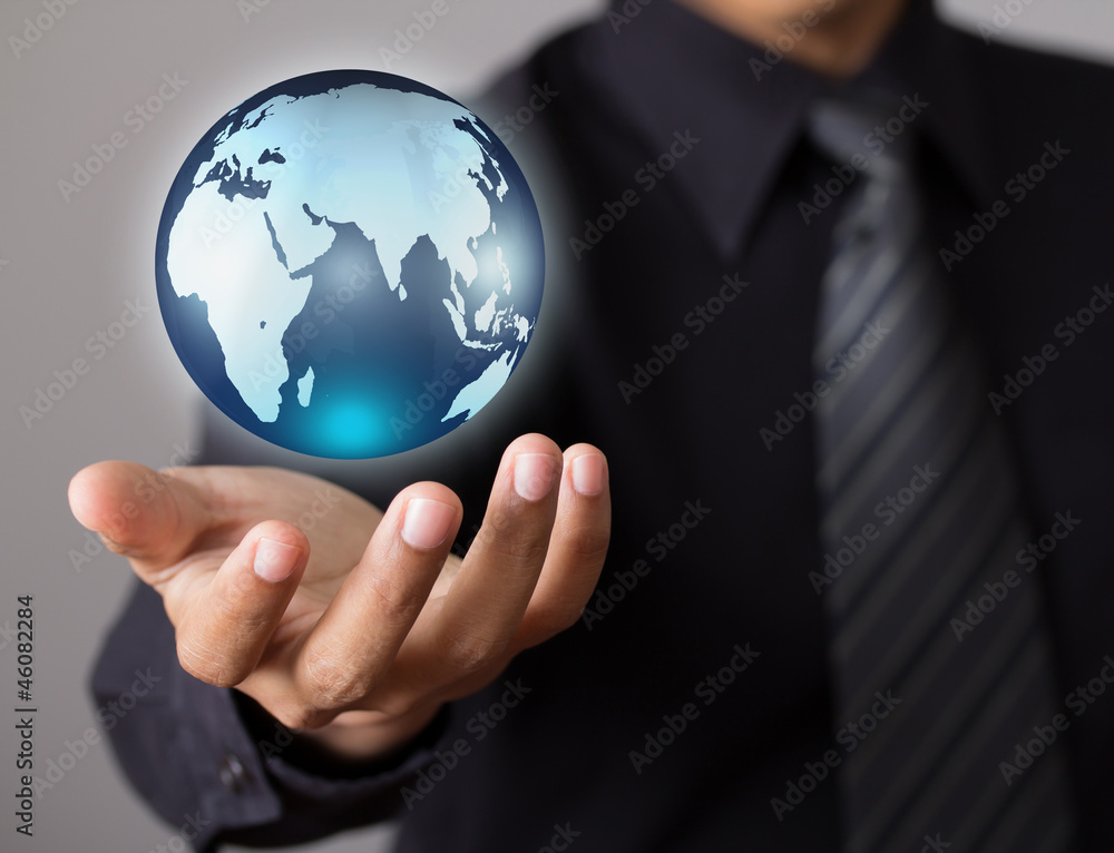 holding a glowing earth globe in his hands holding a glowing earth globe in his hands