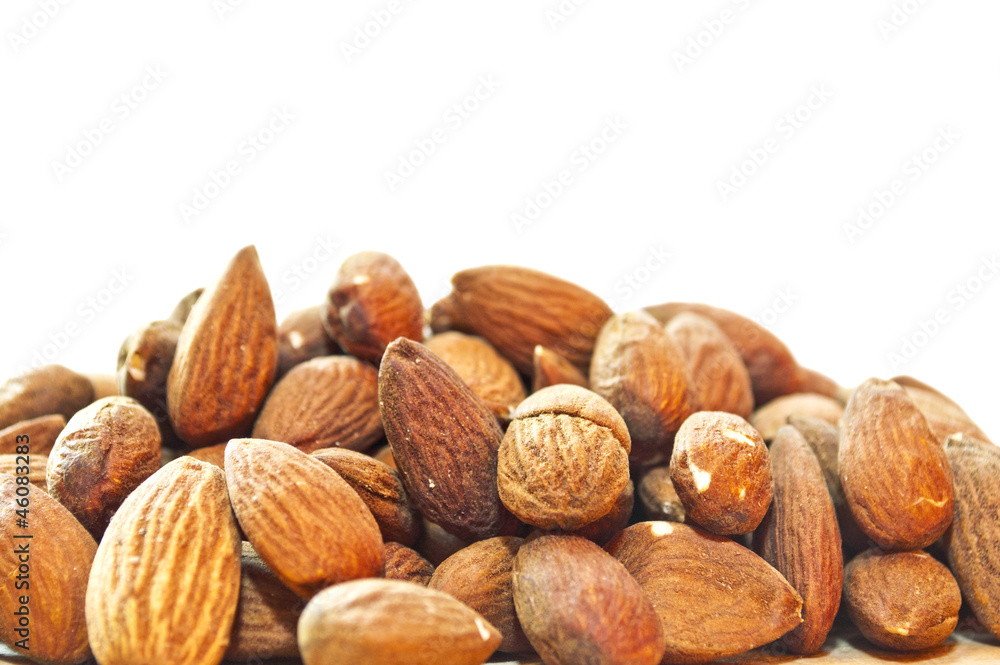 Pile of almonds closeup as a background Pile of almonds closeup as a background