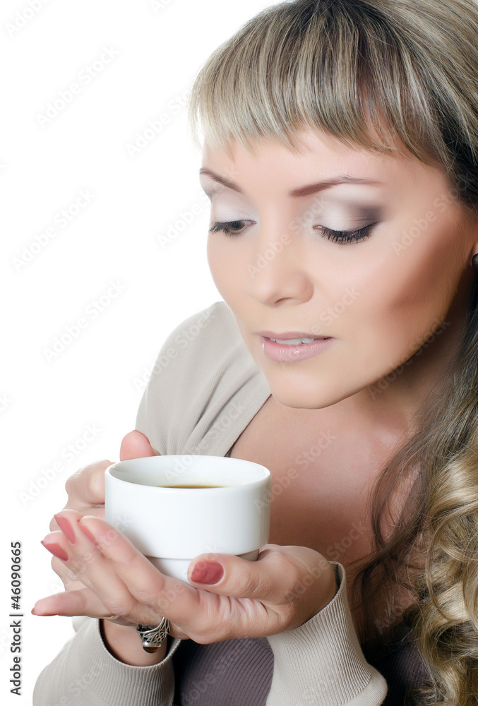 The beautiful elegant woman with a coffee cup The beautiful elegant woman with a coffee cup