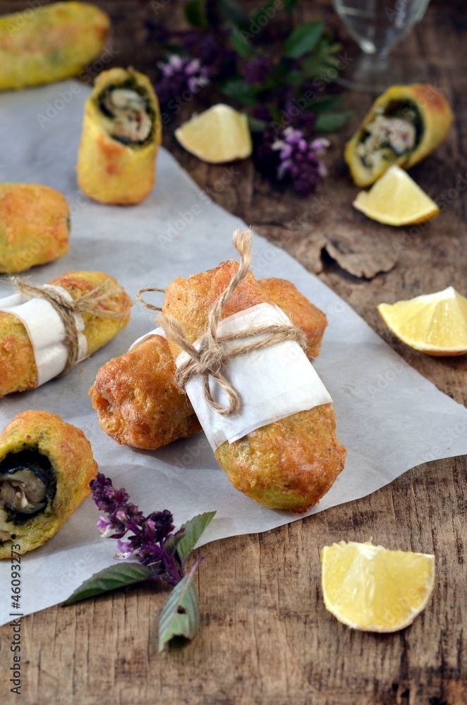 Fried rolls with fish and pesto sauce