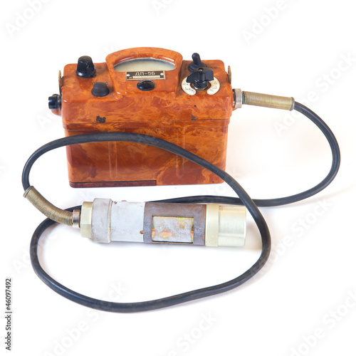 Isolated on white old geiger counter. photo