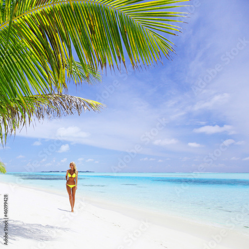 woman in bikini under palm