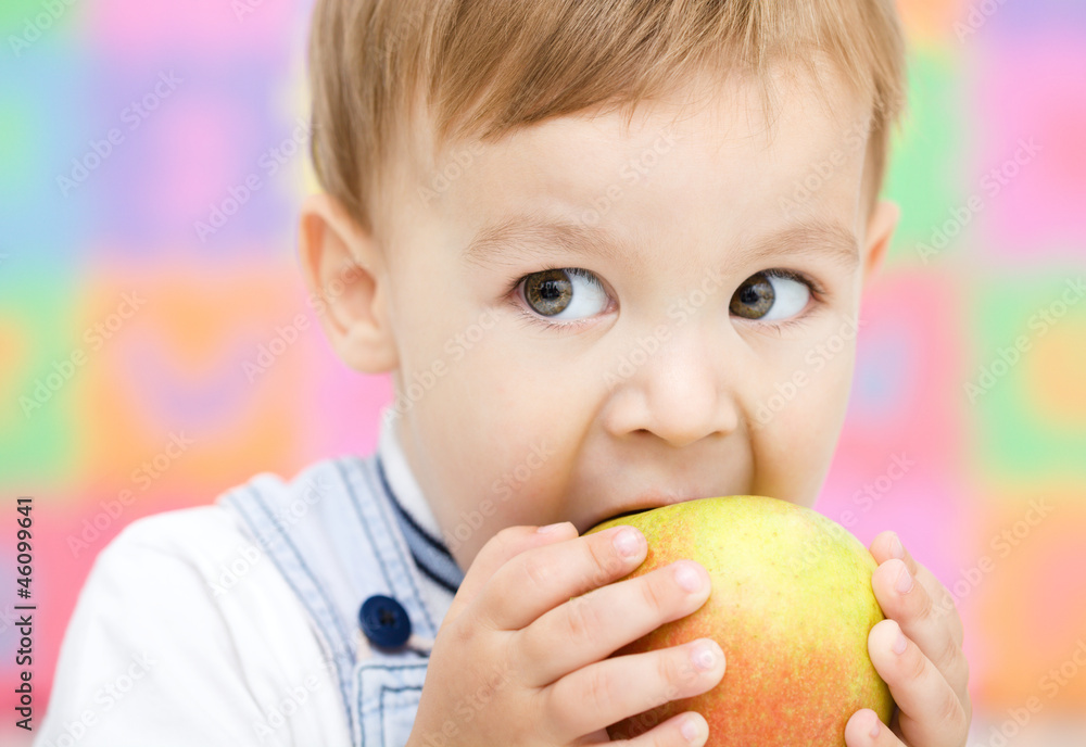 Little child is biting red apple Little child is biting red apple