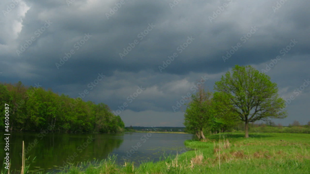 timelapse with storm clouds moving over lake timelapse with storm clouds moving over lake