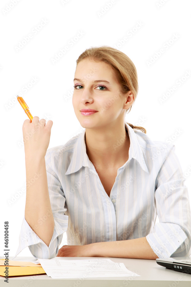 A business woman is working with documents at the desk A business woman is working with documents at the desk